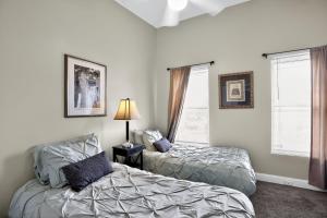 a bedroom with two beds and a window at Baltimore premier townhouse in Baltimore