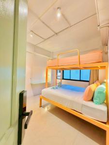 a bedroom with a bunk bed in a room at Lazy Sunday Khaosan Hotel in Bangkok +177 photos