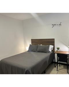 Postel nebo postele na pokoji v ubytování Agenda Hotel