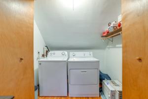 a white washer and dryer in a small kitchen at 1 Mi to Dtwn Binghamton Pet-Friendly Home with Deck in Binghamton +17 photos