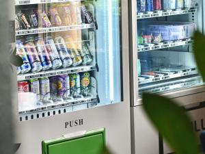 a refrigerator filled with lots of drinks and soda at ibis budget Wrocław Stadion in Wrocław