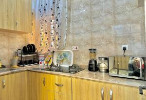 a kitchen with a counter top with a blender at Cozy Corners in Iseri-Oke