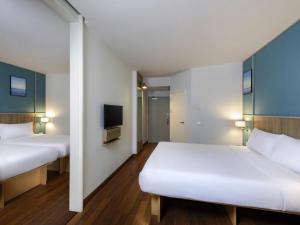 Ένα ή περισσότερα κρεβάτια σε δωμάτιο στο Hotel Ibis Samui Bophut