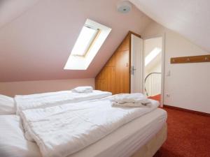 Ένα ή περισσότερα κρεβάτια σε δωμάτιο στο Pilsum - Greetsiel