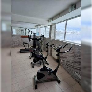 a gym with three exercise bikes in a room at Hotel del cerro in Caviahue