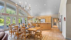 a dining room and kitchen with a table and chairs at Vineyard Estate w Pool Spa Bocce Ball Mins to Wineries Park Lawndale Road by AvantStay in Lawndale