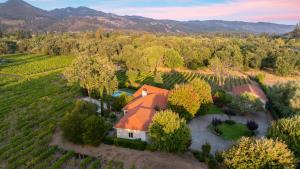 an aerial view of a house with an orange roof at Vineyard Estate w Pool Spa Bocce Ball Mins to Wineries Park Lawndale Road by AvantStay in Lawndale