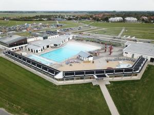 an aerial view of a large swimming pool at Holiday apartment with 2 bedrooms in Wursterheide
