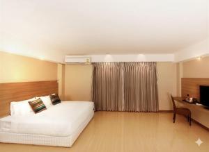 Postel nebo postele na pokoji v ubytování Avana Laem Chabang Boutique Hotel + 15 fotografií