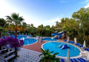 a resort pool with a slide and a water park at Sentido Lycus Beach Hotel in Alanya