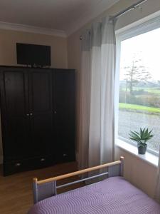 TV a/nebo společenská místnost v ubytování Sunset Room