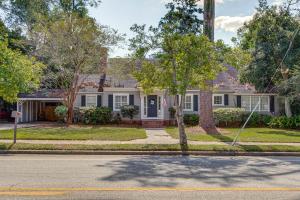 a white house with a blue door at Walk to Dtwn Hahira Inviting Home with Pool and Yard! in Hahira