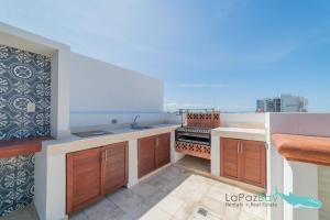 a kitchen with a sink and a counter at Brand New Townhome with Private Rooftop in La Paz +33 photos