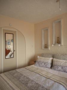 Säng eller sängar i ett rum på La Casa Te Puru Lodge
