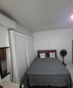 a bedroom with a bed with two pillows on it at Apt estiloso in Sinop