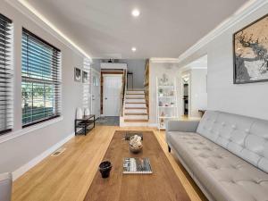 a living room with a couch and a table at Alderwood Escape in Sequim