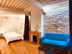 Una cama o camas en una habitación de Le cosy pierre scize