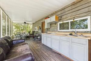 a kitchen and living room of a tiny house at Nola Swamp Farm in Terrytown
