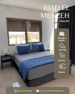 a bed in a bedroom with a sign on it at Riad el menzeh in Bouznika +2 photos