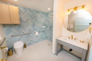 a bathroom with a sink and a mirror at The Boardwalk Hotel in San Diego +55 photos