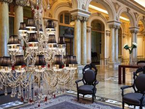 a large room with a chandelier in a building at Sofitel Montevideo Casino Carrasco & Spa in Montevideo +127 photos