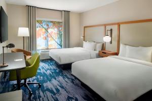 Un pat sau paturi într-o cameră la Fairfield by Marriott Inn & Suites Alpharetta Avalon Area