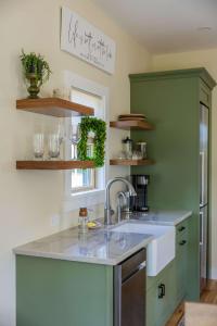 a kitchen with a sink and a counter top at Private Lakefront Retreat The Cottage at Haven in Swain
