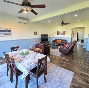 a living room with a dining table and a couch at Immaculate Home w/ Mtn and River Views! in East Wenatchee