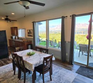 a dining room with a table and chairs with a view at Immaculate Home w/ Mtn and River Views! in East Wenatchee