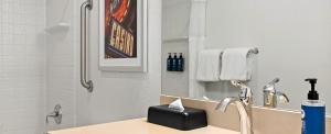 a bathroom with a sink and a mirror at Worldmark Tropicana Avenue in Las Vegas
