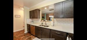 a kitchen with a sink and a counter top at MidLongTerm Rntal Comfy Home Away Near VA Beach in Virginia Beach +42 photos