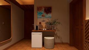 a small white refrigerator in a room with a counter at Hotel Ilha do Marajó by Unna in Soure