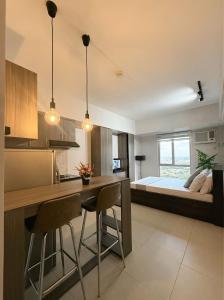 Ένα ή περισσότερα κρεβάτια σε δωμάτιο στο Lovely CondoStay Cebu T2-25