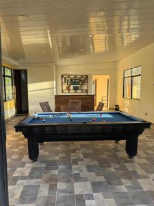a pool table in the middle of a room at Finca Formentera Relax in San Javier
