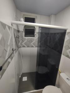 a small bathroom with a shower and a toilet at Apto Studio 202 centro floripa in Florianópolis