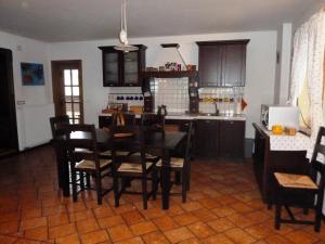 a kitchen with a table and chairs in a room at Apartment Bohinjčan in Bohinj