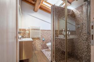 a bathroom with a shower and a sink and a toilet at Small Villa with parking in Florence +25 photos
