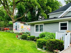 a house with a yard with a white fence at Rainbow Ridge Farms in Onalaska +25 photos