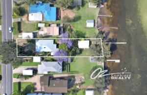 an aerial view of a yard with houses at Jerrinja - Absolute waterfront with jetty - 5 mins to Hyams Beach in Erowal Bay