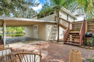 a house with a deck and a patio at Success Loft in Lakeland