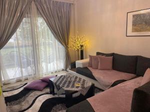 a living room with a couch and a table at Andromache's Cozy Villa close to Meteora-Trikala in Tríkala
