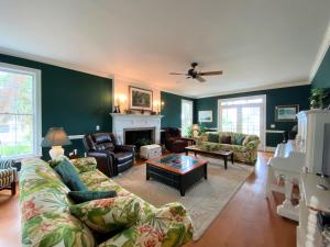 a living room with a couch and a fireplace at Marsa's Place in Edisto Island