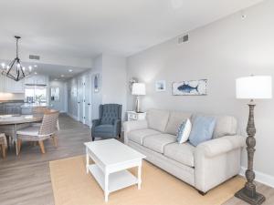 a living room with a couch and a table at Ocean Pearl in Tybee Island