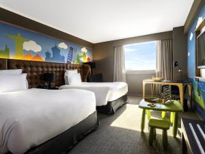 Krevet ili kreveti u jedinici u okviru objekta Pullman Sao Paulo Guarulhos Airport