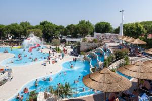 a group of people in a pool at a water park at Ca' Pasquali Village in Cavallino-Treporti