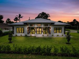 a rendering of a house at sunset at Elegant Naples Studio with Huge Bathroom in Naples