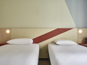 Giường trong phòng chung tại ibis budget Paris Porte d'Aubervilliers