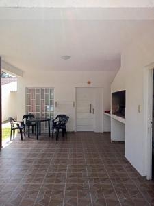 a dining room with a table and chairs at Nuestro Rinconcito in Villa Cura Brochero