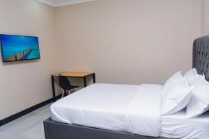 Palms & Pebbles Lodge客房内的一张或多张床位 更多13张照片