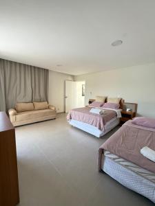 Postel nebo postele na pokoji v ubytování Costa do Sauípe 5 suítes, piscina, hidromassagem e área de lazer completa + 31 fotografií
